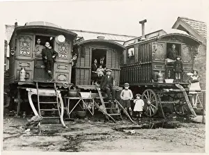 Prints of Gypsies stand outside their caravans in a corner of the huge gypsy camp near Grantham, Lincolnshire Lincolnshire Prints: Gypsy Caravan Camp Print