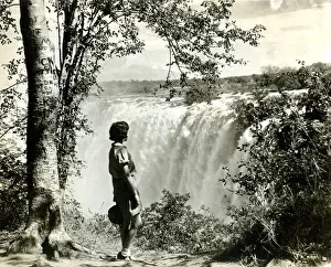 Girl standing by Victoria Falls, southern Africa Girl standing by Victoria Falls, southern Africa