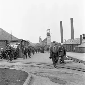 Prints of Miners from Glapwell Colliery, north east Derbyshire, black and dirty from the pit at the end of their work shift. Some carry miners lamps Derbyshire Prints: Glapwell Colliery Miners Print, 1970s Derbyshire