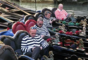 Four gondoliers in their gondolas behind St Marks, Venice Four gondoliers in their gondolas behind St Marks, Venice