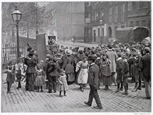A group of amused London children gather round to watch a traditional Punch and Judy A group of amused London children gather round to watch a traditional Punch and Judy