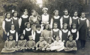 Group of schoolchildren with teacher, nurse and cat Group of schoolchildren with teacher, nurse and cat