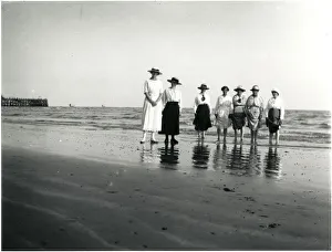 Group of women paddling at a British seaside resort Group of women paddling at a British seaside resort