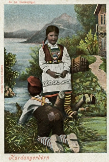 Hardanger, Norway - boy and girl in traditional costume Hardanger, Norway - boy and girl in traditional costume