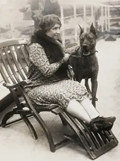 Prints of Helen Keller (1880-1968) born blind deaf mute. Thanks to her governess she overcame these handicaps, studied and created in 1921 the American Foundation for the Blind. Pictured here on the S.S Cleveland Prints: Helen Keller with her Great Dane on the S.S. Cleveland Print
