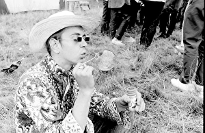 Hippy man blowing bubbles at Woburn Park Hippy man blowing bubbles at Woburn Park