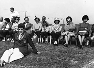 Holidaymakers and a Redcoat at Butlins holiday camp Holidaymakers and a Redcoat at Butlins holiday camp