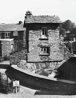 Prints of This house was built on a bridge over a river in 1680. It is situated in Ambleside, Westmorland Westmorland Prints: House over River, Ambleside Print