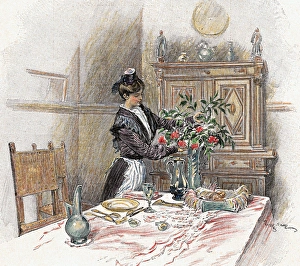 Housemaid decorating the table with a vase of flowers. Color Housemaid decorating the table with a vase of flowers. Color