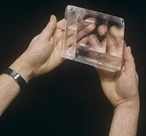 Prints of A specimen of Iceland spar from Rodefjord, Iceland. Transparent crystal composed of the mineral, calcite (calcium carbonate) which has unusual property of double refraction Iceland Prints: Iceland Spar Print: Double Refracting Calcite Crystal
