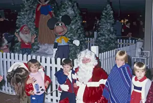 Children Meet Santa Claus Print: A Festive Holiday Scene