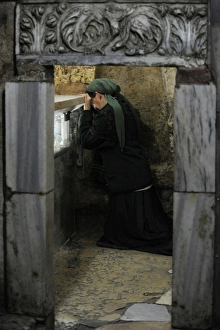 Israel. Jerusalem. Tomb of the Virgin Mary. Woman praying Israel. Jerusalem. Tomb of the Virgin Mary. Woman praying