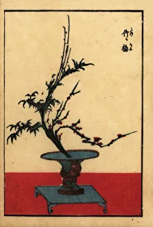 Japanese flower arrangement with bamboo and plum Japanese flower arrangement with bamboo and plum