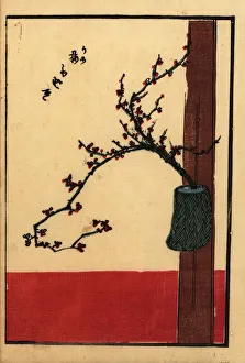 Japanese flower arrangement with plum in a vase on a beam Japanese flower arrangement with plum in a vase on a beam