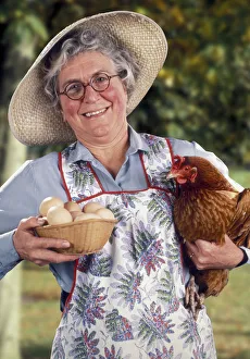 Jolly farmers wife with hen and eggs Jolly farmers wife with hen and eggs