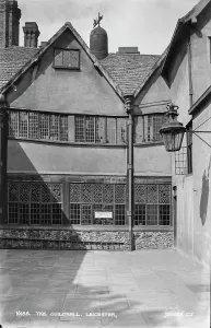 Prints of This image shows the historic Guildhall in Leicester, featuring its unique architecture with large windows and a stone base Leicestershire Prints: Print of The Guildhall, Leicester (1934)