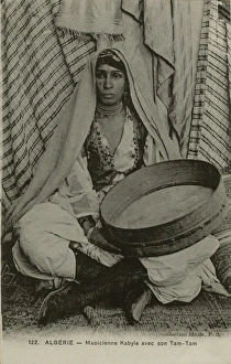 A Kabyle musician with her Tam-Tam. Algeria, North Africa A Kabyle musician with her Tam-Tam. Algeria, North Africa