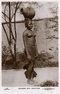 Khartoum, Sudan, Africa - Sudanese girl carrying a water pot Khartoum, Sudan, Africa - Sudanese girl carrying a water pot