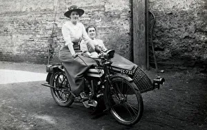 Two ladies on a 1914 Triumph motorcycle Two ladies on a 1914 Triumph motorcycle