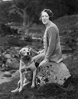 Prints of Lady Bearsted, formerly Dorothy Montefiore Micholls, wife of Walter Samuel, 2nd Viscount Bearsted. Pictured with a pet dog at Newtonmore, Invernesshire where the couple had a home, Phones Upton Prints: Lady Bearsted with Pet Dog, Newtonmore, 1929 Print
