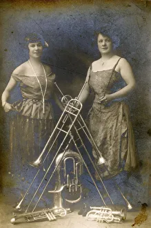 Two Lady Brass Musicians and a variety of their instruments Two Lady Brass Musicians and a variety of their instruments