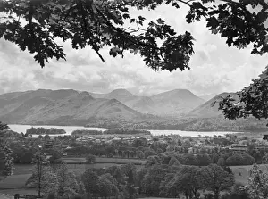 Prints of Derwentwater and Newlands Falls, Lake District, Cumbria, England. This glorious view is seen from the route to Skiddaw, with part of Keswick in the foreground. Date: 1930s Lake Prints: Lake Derwentwater Print, Cumbria, England 1930s