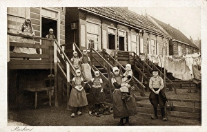 Large dutch family outside their wooden home at Marken Large dutch family outside their wooden home at Marken