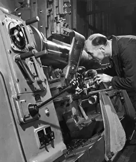 Industrial Manufacturing Process Prints: A lathe operator at work