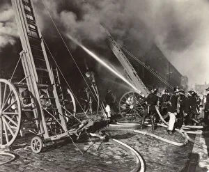 LFB firefighters in action in a London street LFB firefighters in action in a London street
