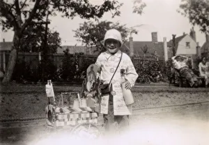 Little girl dressed up as a milk delivery person Little girl dressed up as a milk delivery person