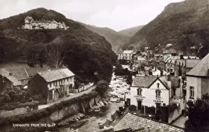 Prints of Lynmouth, Devon on the edge of Exmoor, south west England. View from the Quay of the West Lyn River, with Countisbury Hill rising on the left. Date: circa 1920 Lynmouth Prints: Lynmouth, Devon Print circa 1920