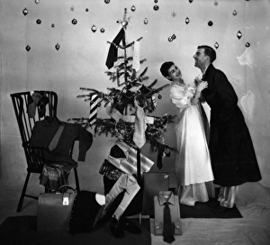 Male and female models in Christmas morning scene Male and female models in Christmas morning scene
