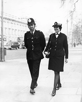 Male and female police officers on duty in London Male and female police officers on duty in London