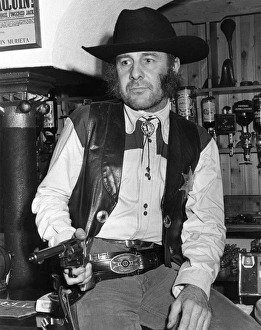 Man in cowboy outfit, Hayle, Cornwall Man in cowboy outfit, Hayle, Cornwall
