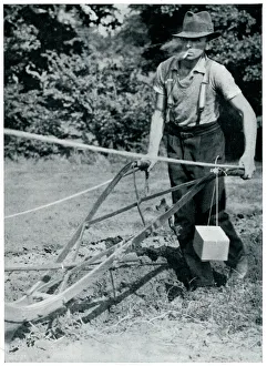 Man ploughing with gas mask, September 1939 Man ploughing with gas mask, September 1939