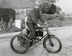 Man riding an 1899 Marot-Gardon vintage tricycle Man riding an 1899 Marot-Gardon vintage tricycle