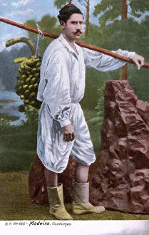 Man in traditional costume, carrying bananas, Madeira Man in traditional costume, carrying bananas, Madeira