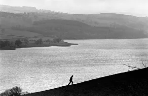 A man walks up a hill above Bala Lake, Gwynedd. North Wales A man walks up a hill above Bala Lake, Gwynedd. North Wales