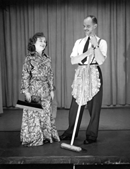Man and woman performing a comic sketch Man and woman performing a comic sketch