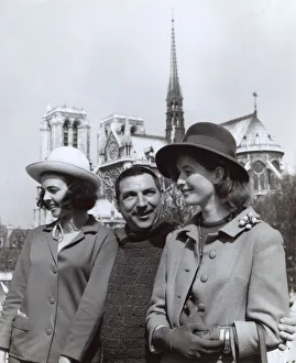 Man and two women near Notre Dame, Paris, France Man and two women near Notre Dame, Paris, France