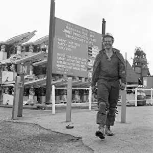 Prints of Markham Colliery near Chesterfield, Derbyshire, England. A smiling coal miner stands in front of a production table notice, which states target, and actual outputs Derbyshire Prints: Markham Colliery Print: Tragedy at the Derbyshire Mine, 1973