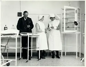 Matron Instructs Nurse Print: A Matron Explains Medical Equipment
