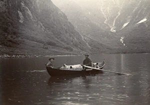 Two men with pigs on the Esserfjord, Norway Two men with pigs on the Esserfjord, Norway