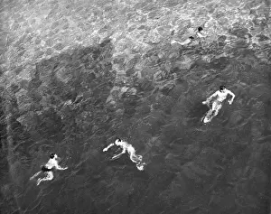 Relaxing By The Sea Prints: Four Men Swimming