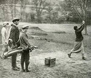 Men and women playing golf at Beaconsfield, Buckinghamshire Men and women playing golf at Beaconsfield, Buckinghamshire