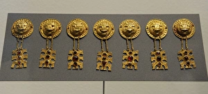 Metal Age. Gold ornaments with lions head. Womans grave fr Metal Age. Gold ornaments with lions head. Womans grave fr