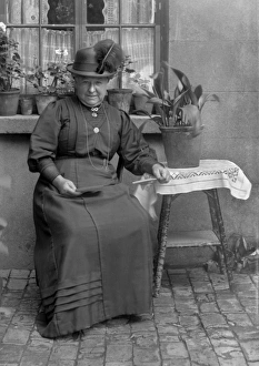 Middle-aged woman with potted plants Middle-aged woman with potted plants