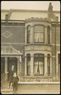 Middle Class Terrace Print: A Boy and Man in School Uniform