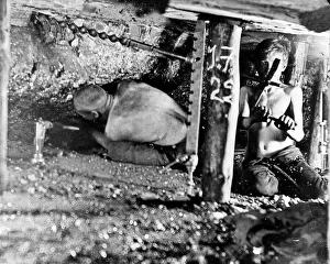 Two miners in a narrow coal seam, South Wales Two miners in a narrow coal seam, South Wales