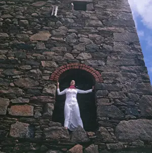 Cornish Architecture Photos Prints: Model standing in an archway, Cornwall
